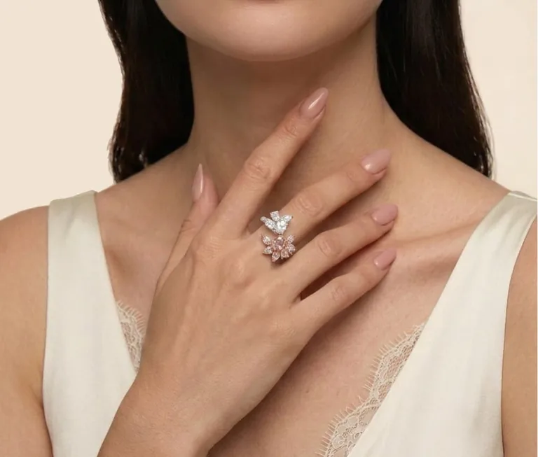 The Aurora fancy pink diamond ring worn on the hand