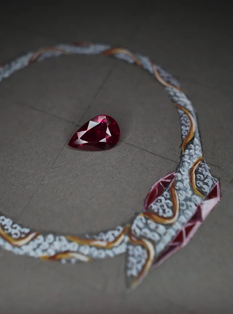 A Burmese ruby laid on a hand-painted gouache necklace design