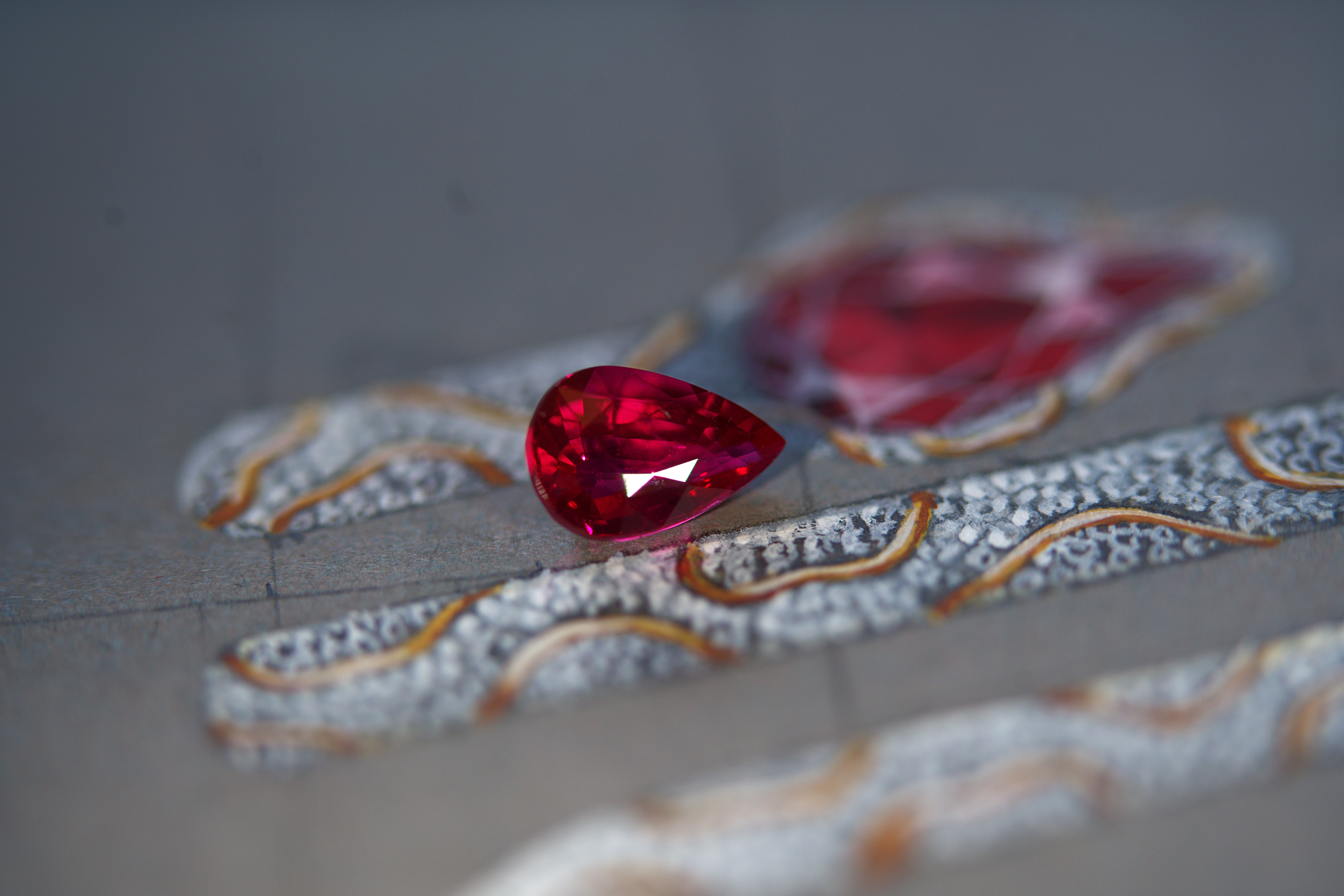 Loose pigeon blood ruby gemstone with bespoke snake ring design painting
